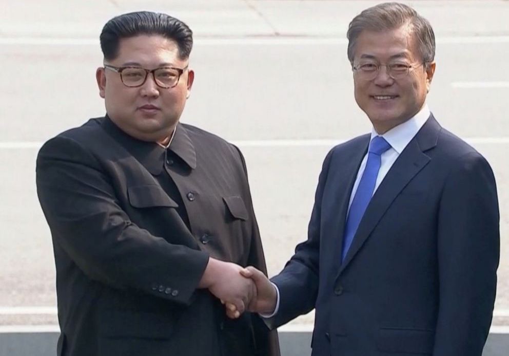 Kim Jong-un shakes hands with Moon Jae-in